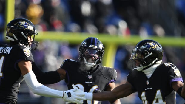 Dec 24, 2022; Baltimore, Maryland, USA; Baltimore Ravens cornerback Marlon Humphrey (44) celebrates with safety Kyle Hamilton (14) after a tackle during the first half against the Atlanta Falcons at M&T Bank Stadium. Mandatory Credit: Tommy Gilligan-USA TODAY Sports